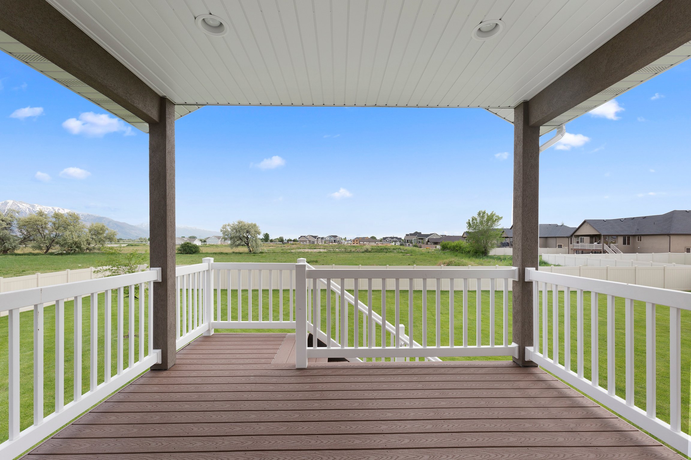 Covered patio and deck of new home